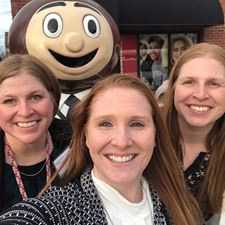 Quatman sisters posing with a statue of Brutus Buckeye