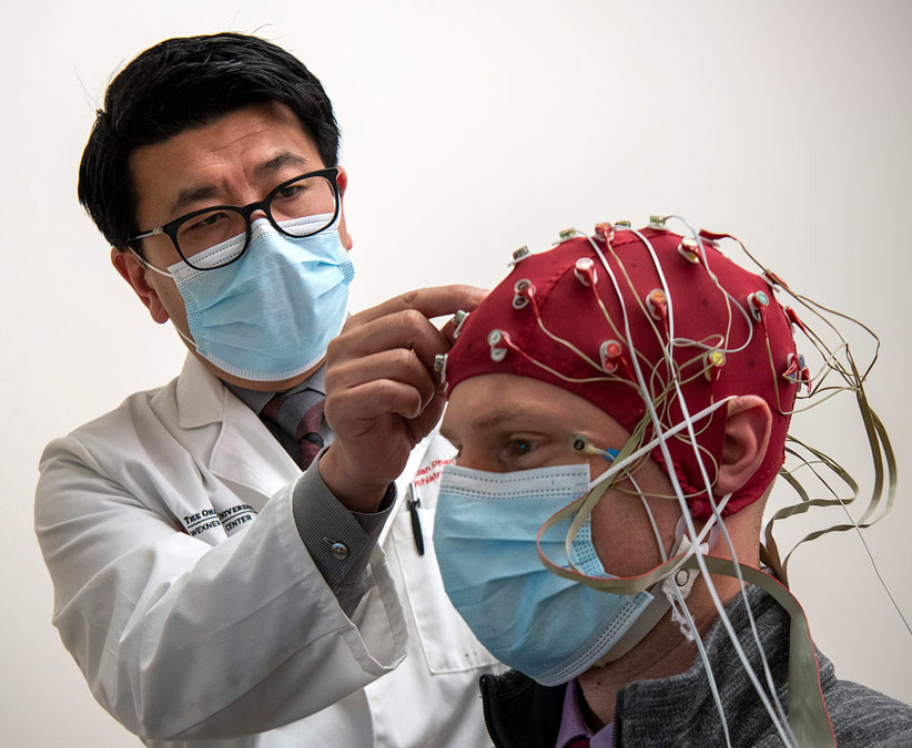 Dr. K. Luan Phan working with a research participant