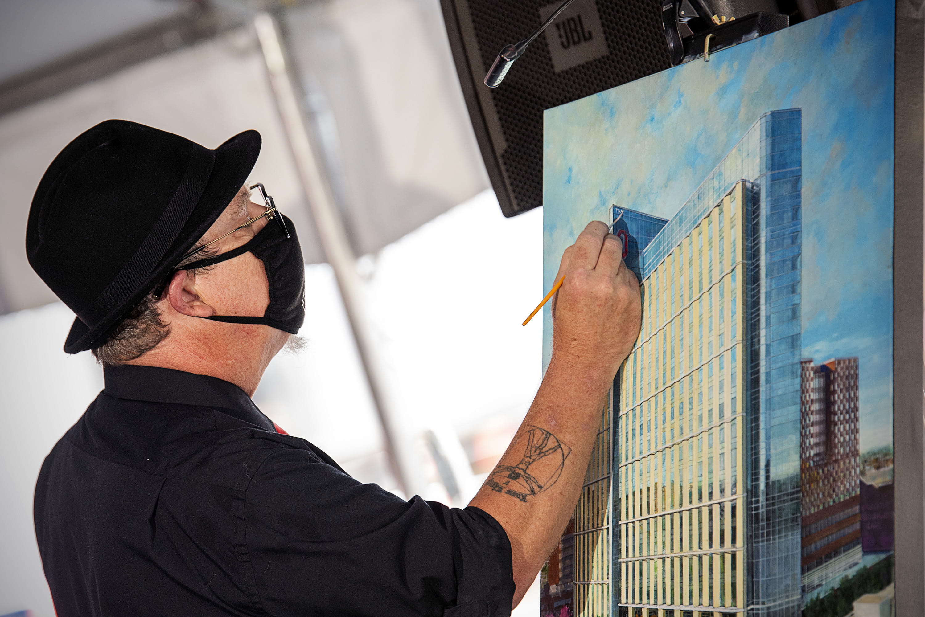 Artist Keith Keith Alan Hasenbalg paints new inpatient hospital during celebration event.