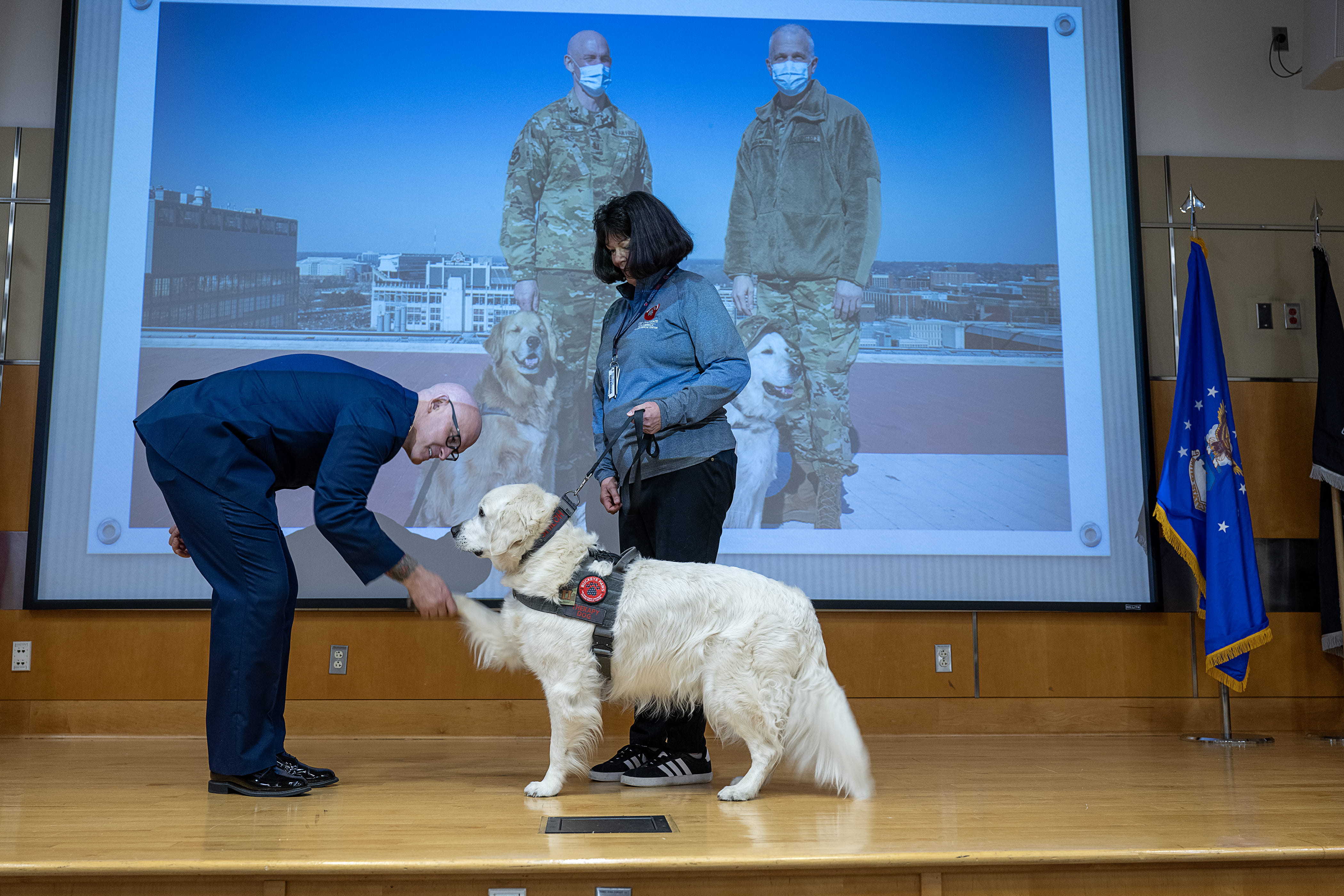 Capt. Greg Geisler, Capt. Shiloh and Mary Justice during Buckeye Paws therapy dog Shiloh's honorary military promotion. 