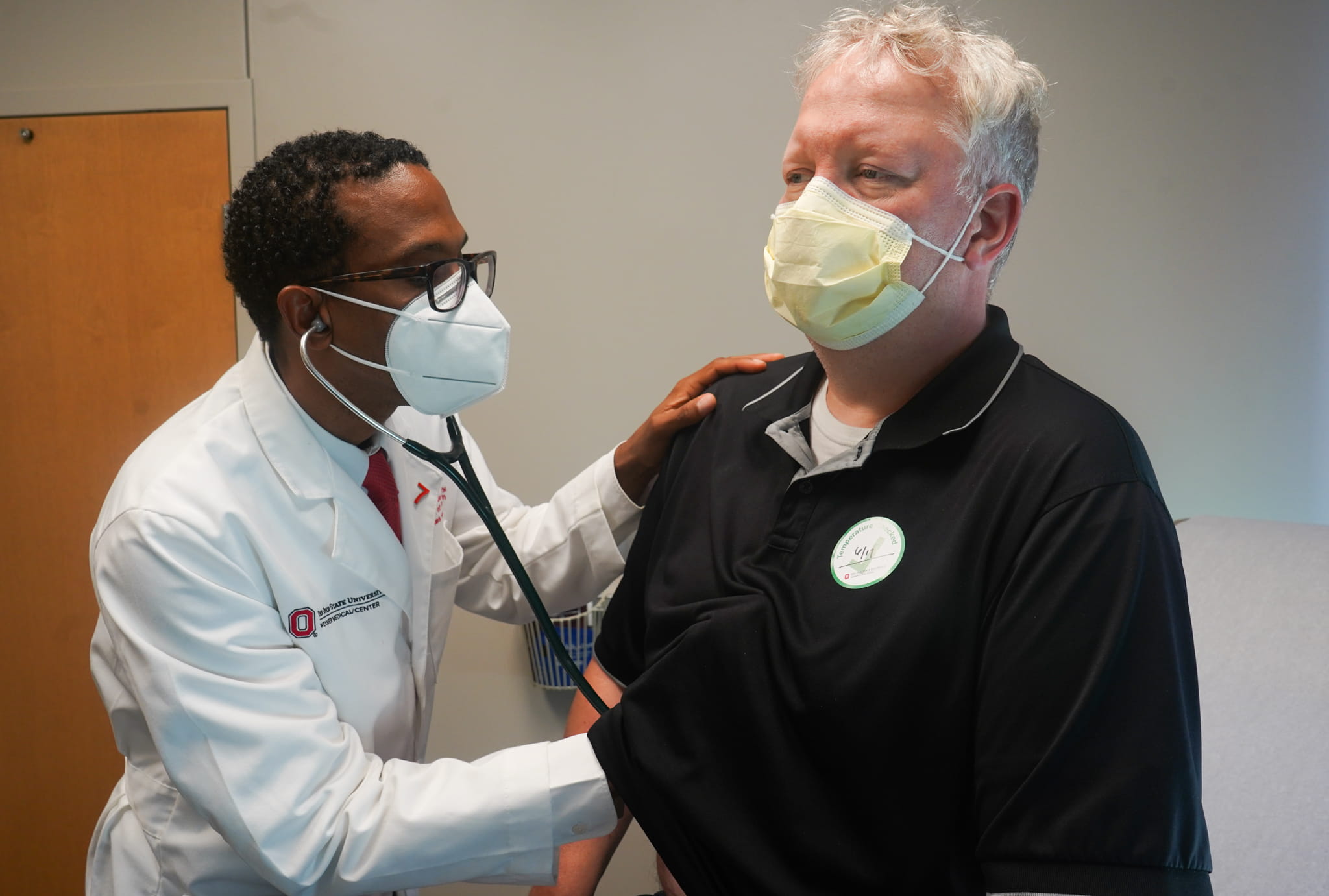 Dr. Joshua Joseph examines a patient