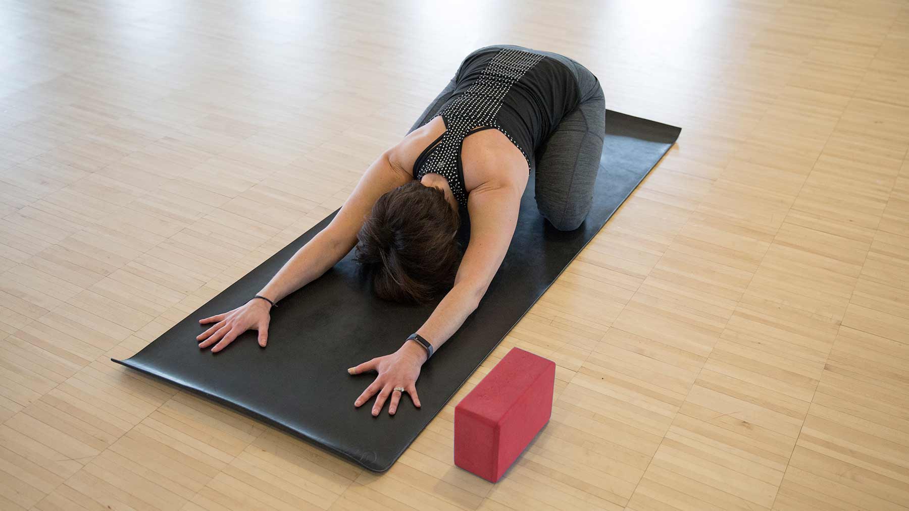 Woman doing yoga as example of how to relieve pain without using opioids