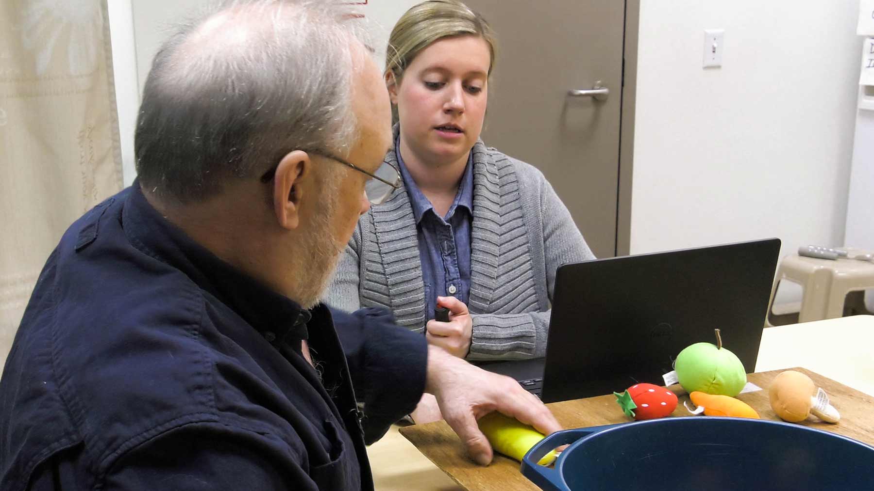 Patient Ken Meeks works with his therapist as part of a clinical trial studying the Vivistim vagus nerve stimulation device for stroke rehab