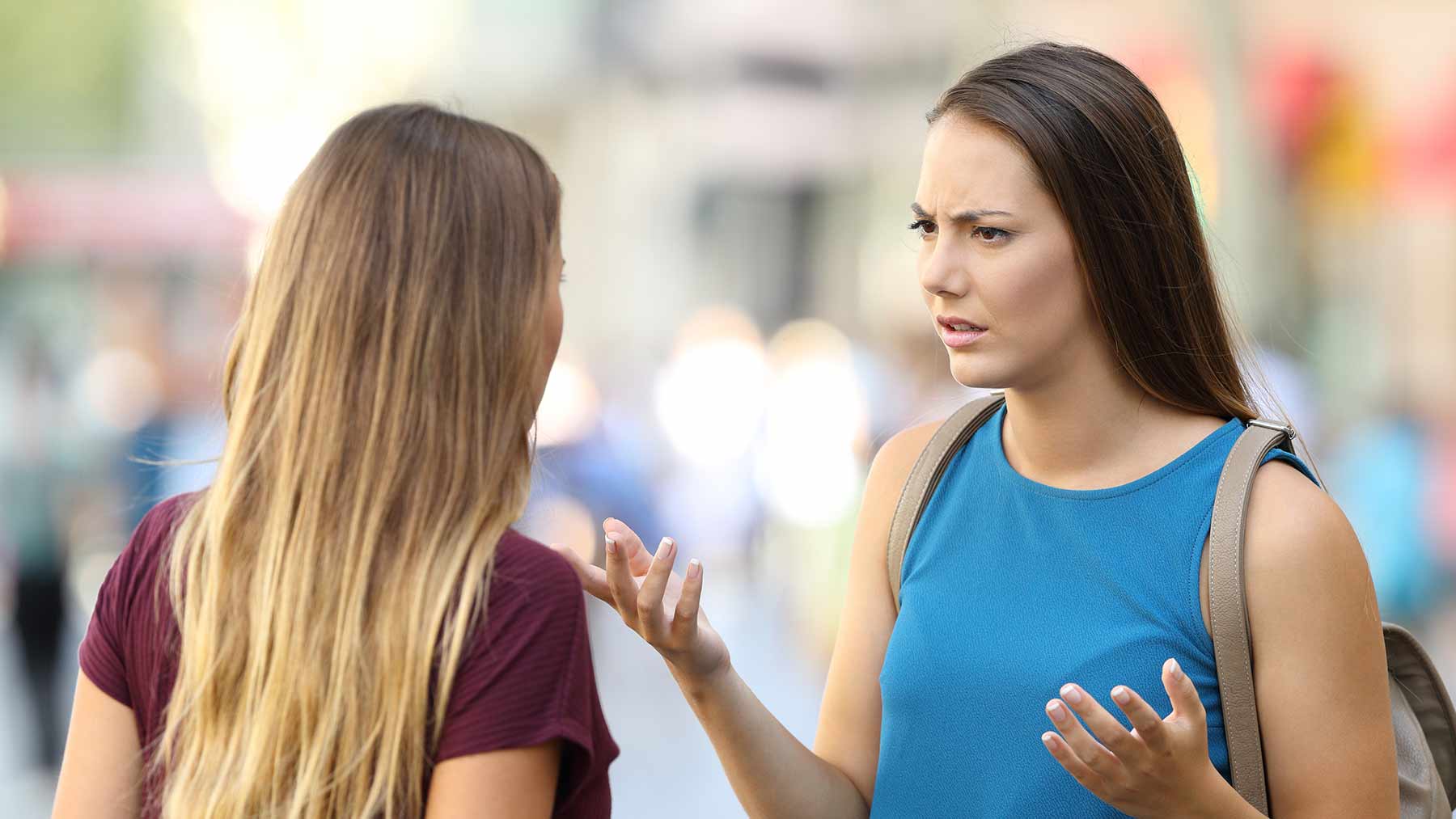 Two women talking and one looks concerned