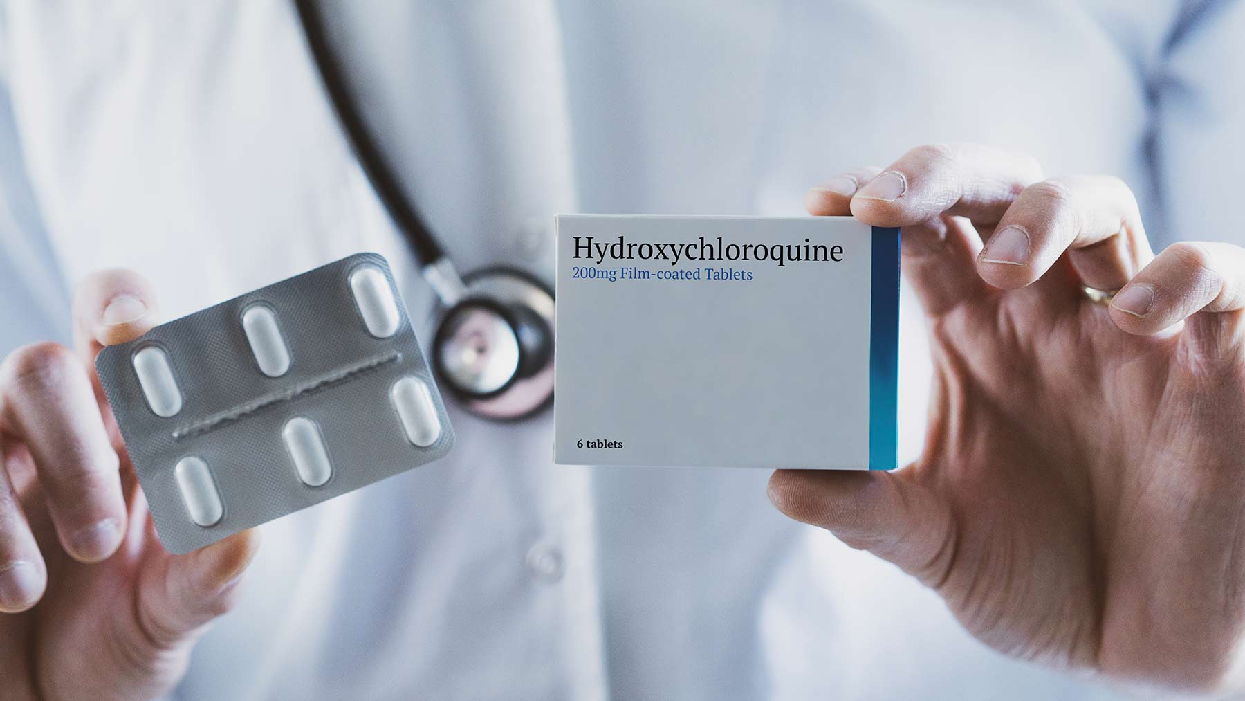 Doctor holding antimalarial drug hydroxychloroquine