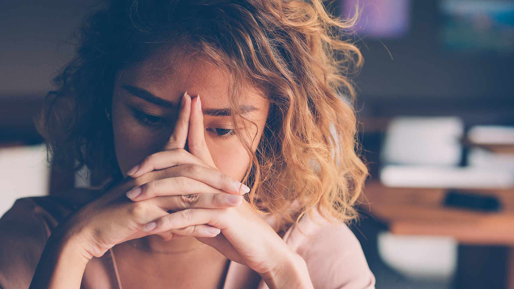 Young woman looks sad