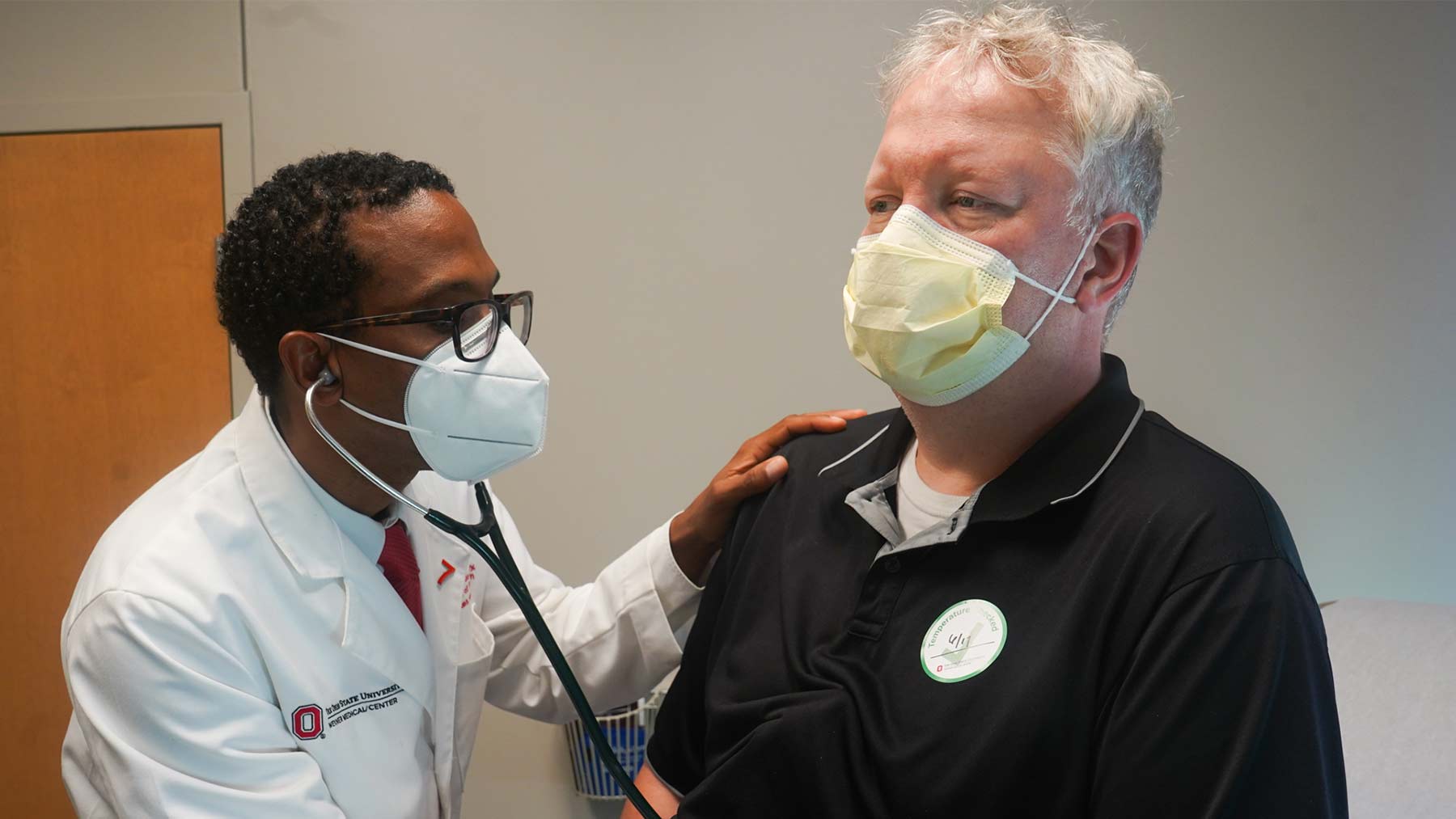 Dr. Joshua Joseph examines a patient