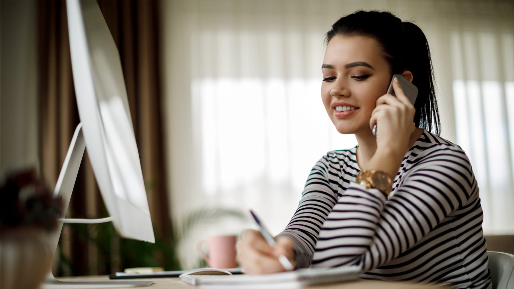 Woman scheduling an appointment on the phone