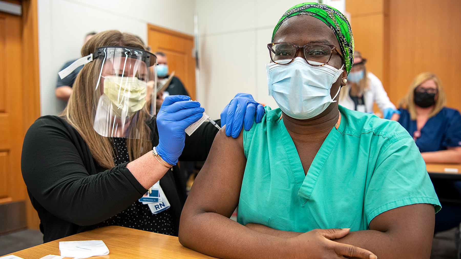 Female healthcare worker receives COVID-19 vaccine