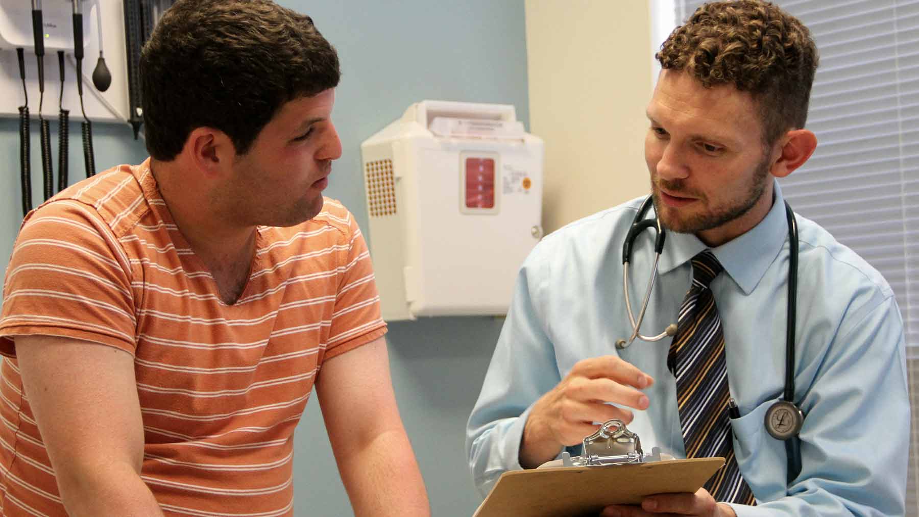 Dr. Christopher Hanks with a patient