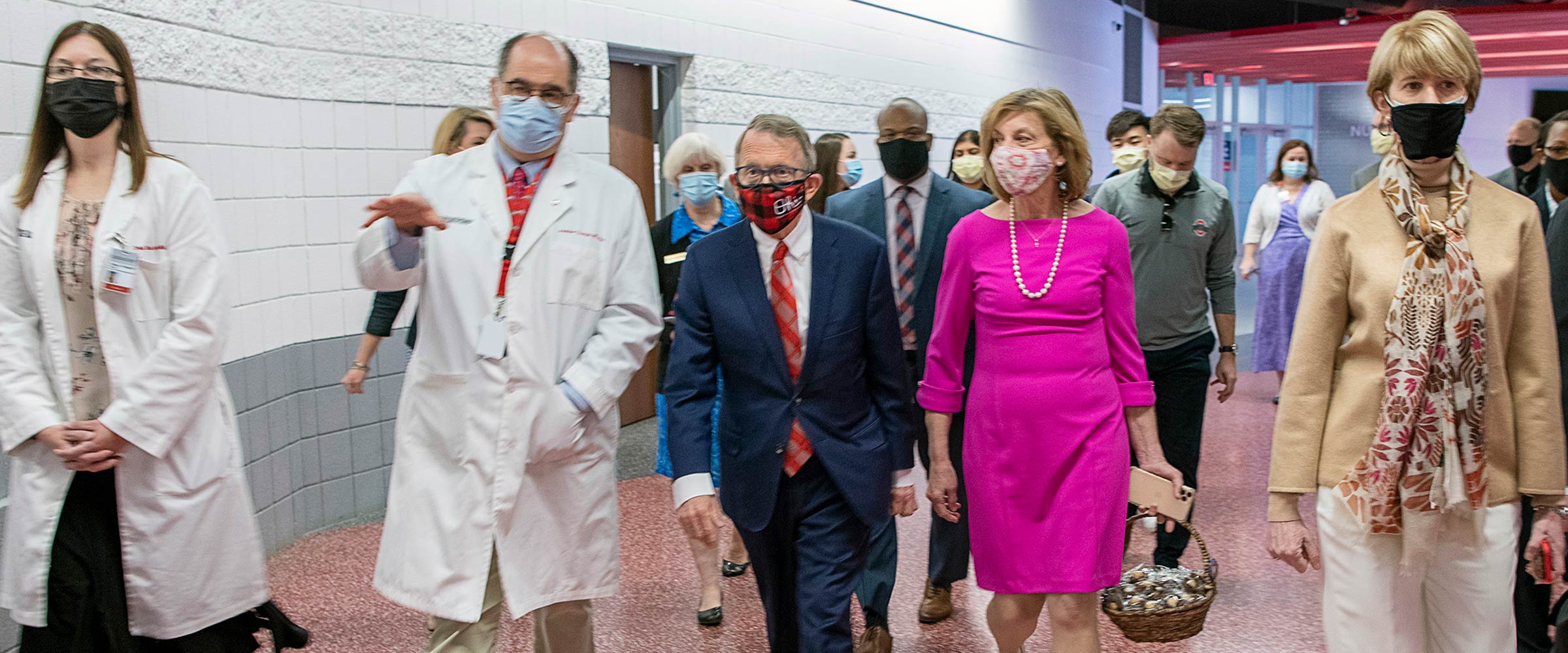 Andy Thomas showing the governor the vaccine clinic