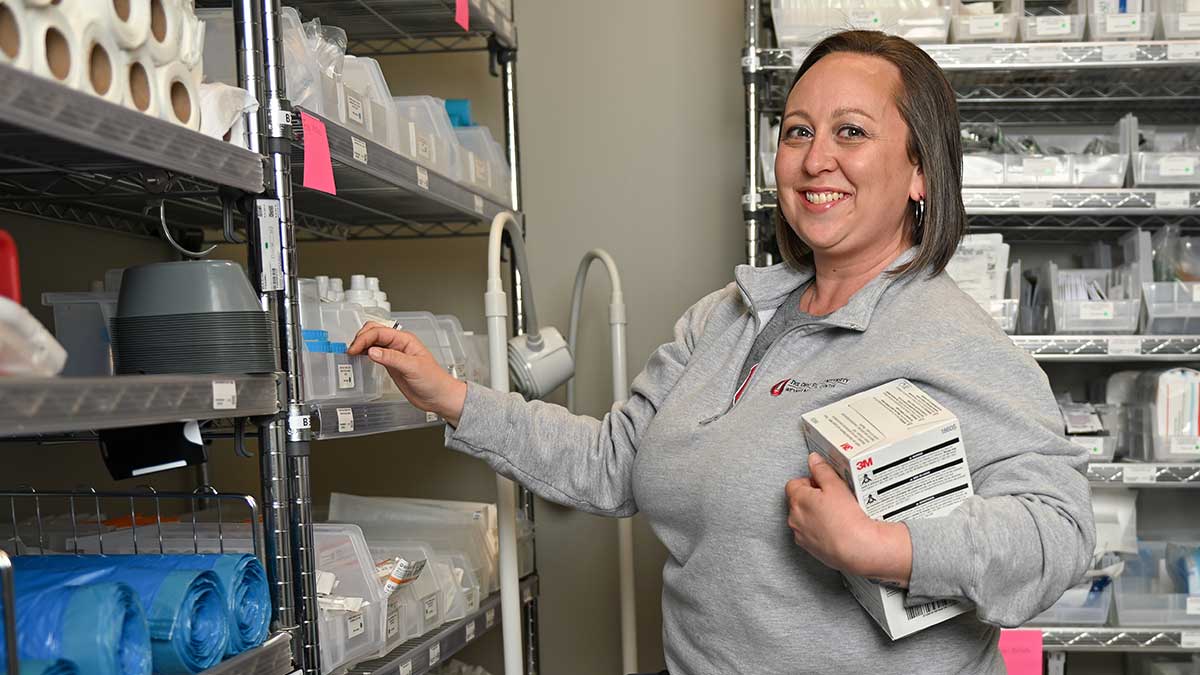 Ashley Ferguson, Supply Chain Coordinator, in room with medical supplies