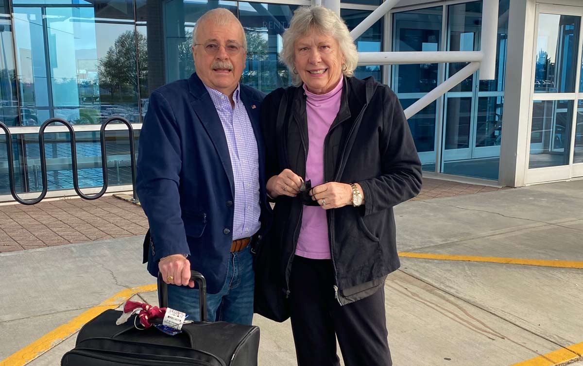 patient Jimmy Moore with his wife at the airport