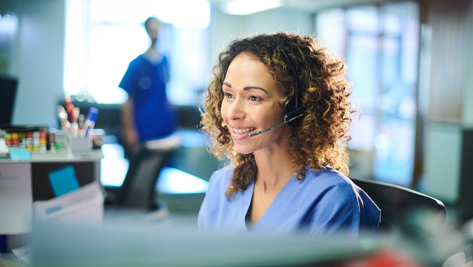 Nurse using a headset to answer phone calls