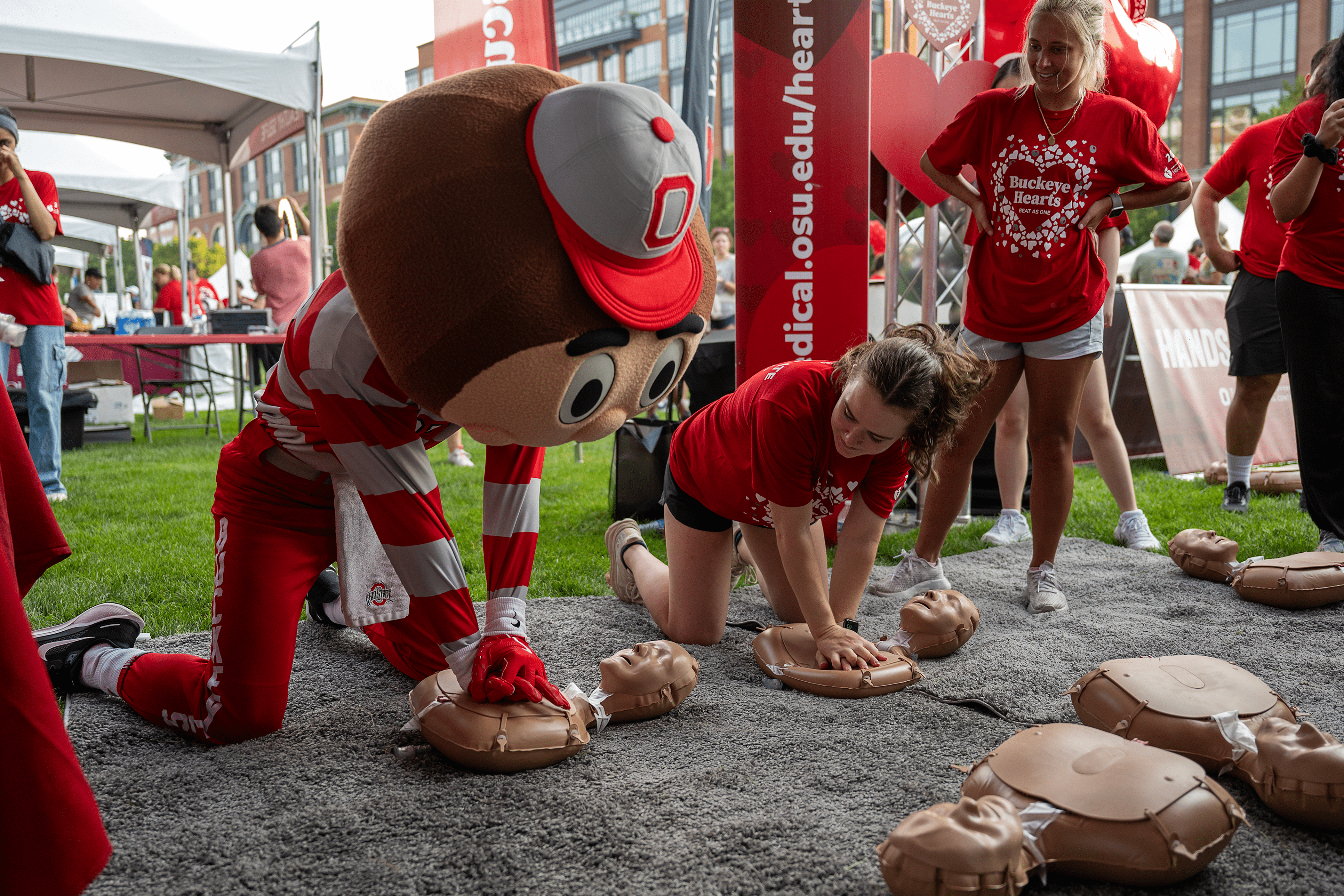 Brutus and student performing hands only CPR