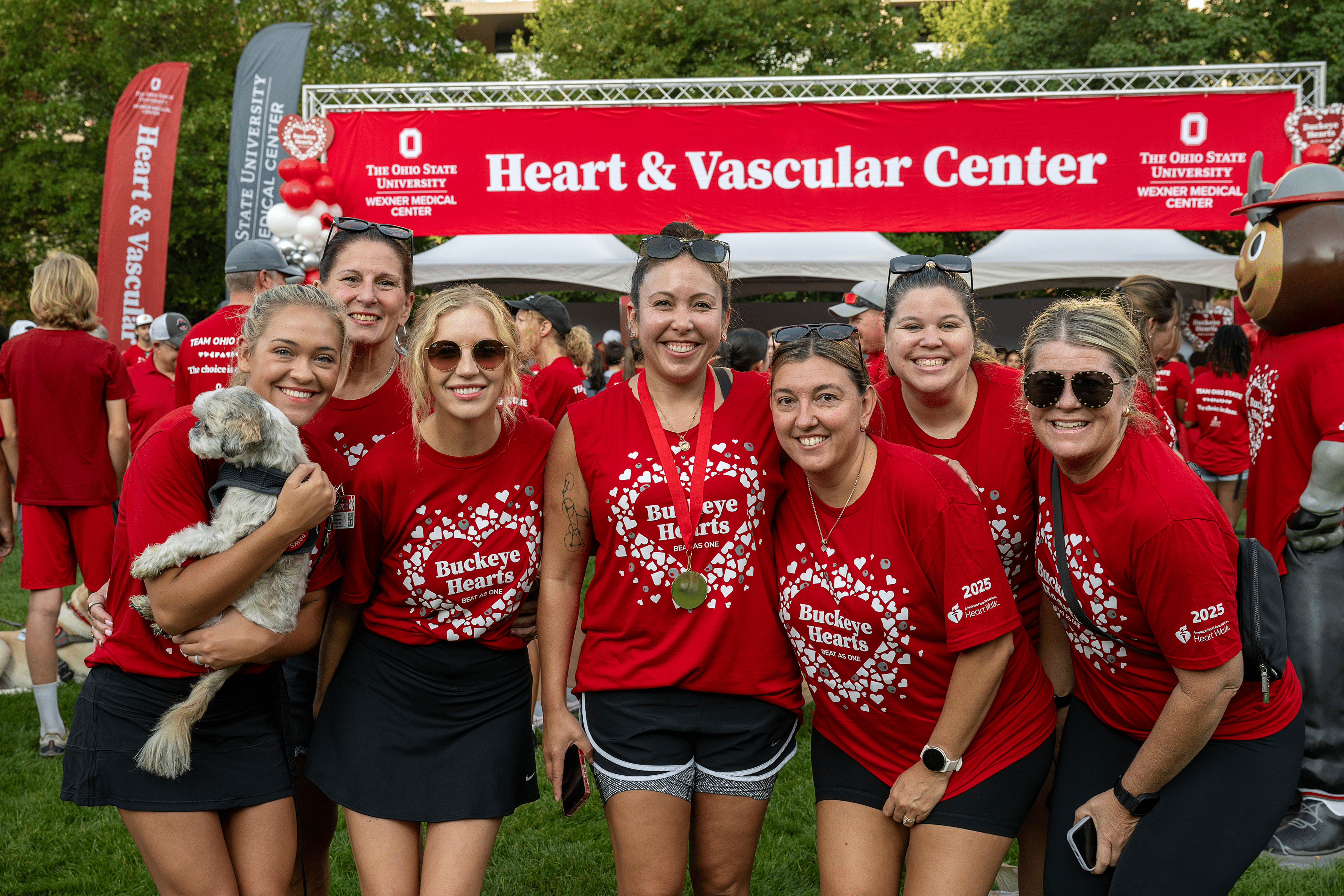 Seven female heart walkers wearing red Team Ohio State t-shirts