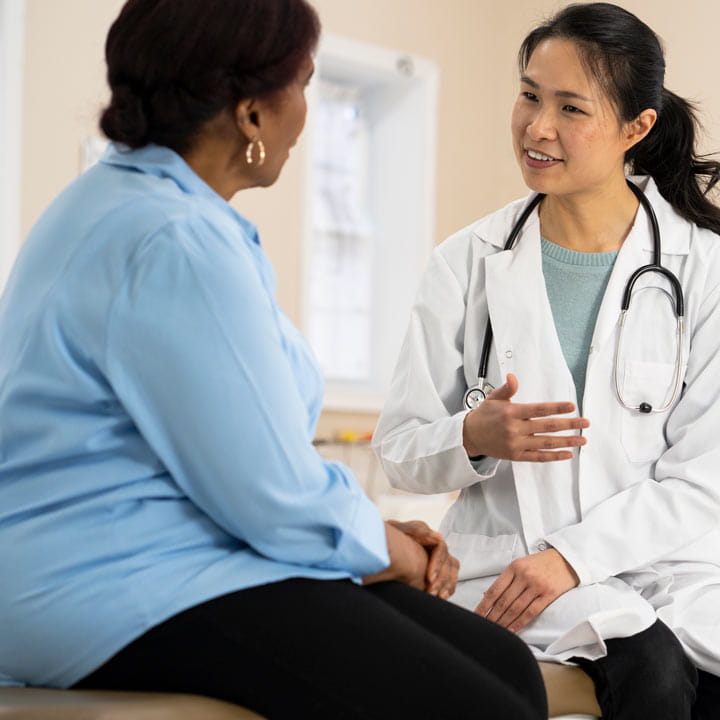 Doctor talking with a weight loss patient