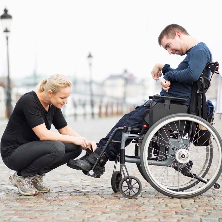 Disabled-man-wheelchair-rehab-shoes
