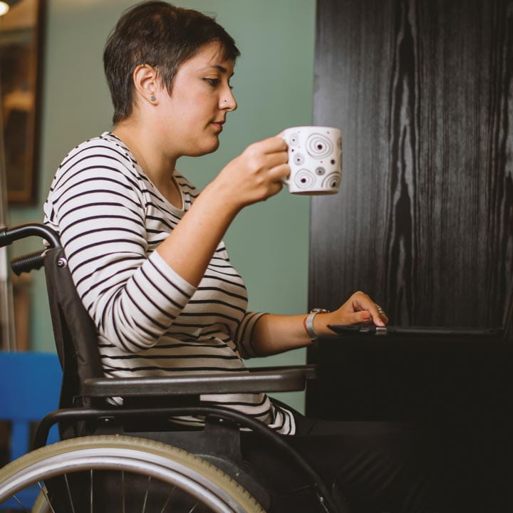 woman-in-wheelchair-working-at-laptop