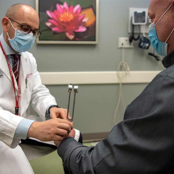 Doctor examining patient hand