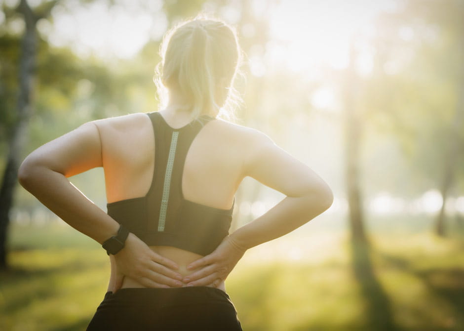 Athlete woman with lower back pain