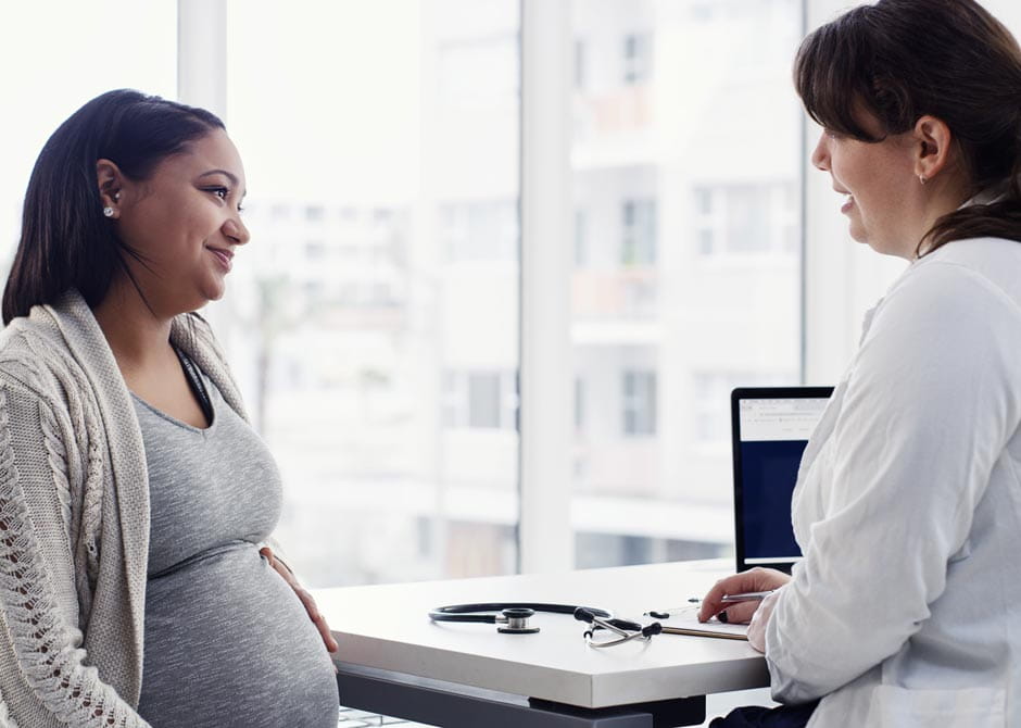 Pregnant Woman Speaking to a Doctor
