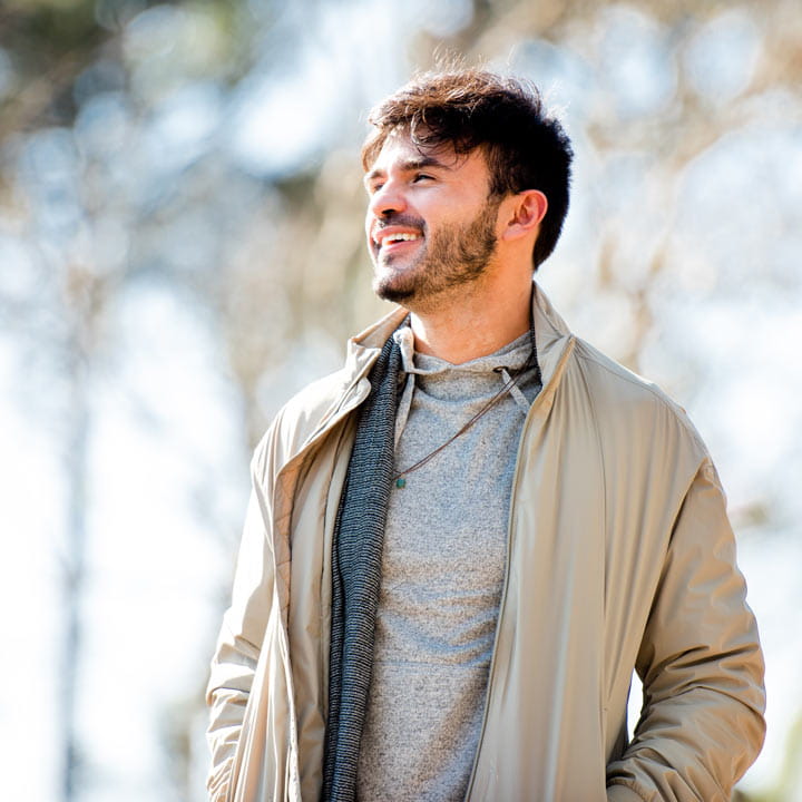 smiling-man-walking-outside