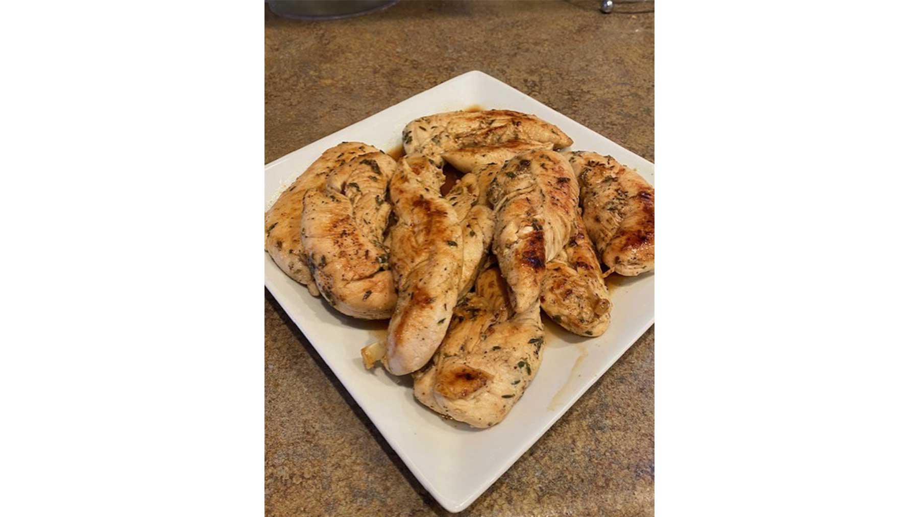 apple cider braised chicken tenders on a plate