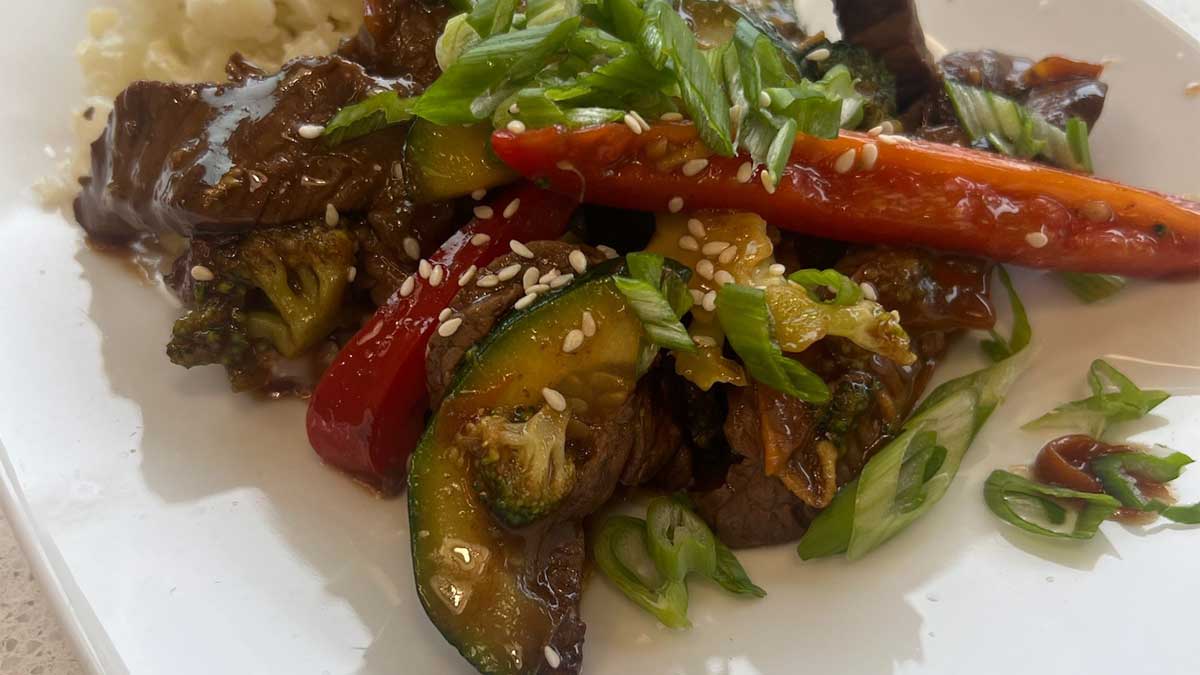 stir fry on a plate with coconut cauliflower rice