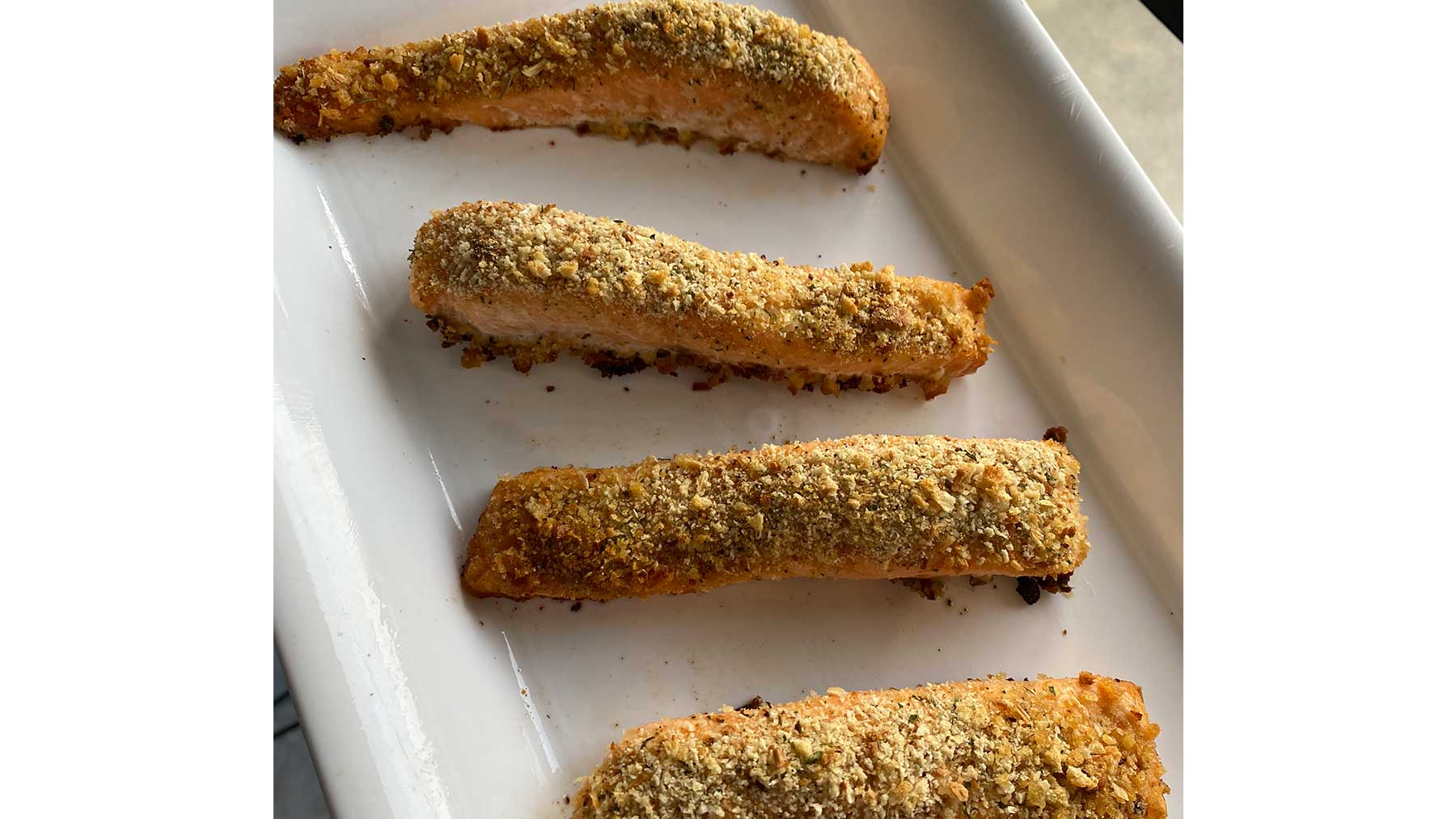 herb crusted fish on a plate