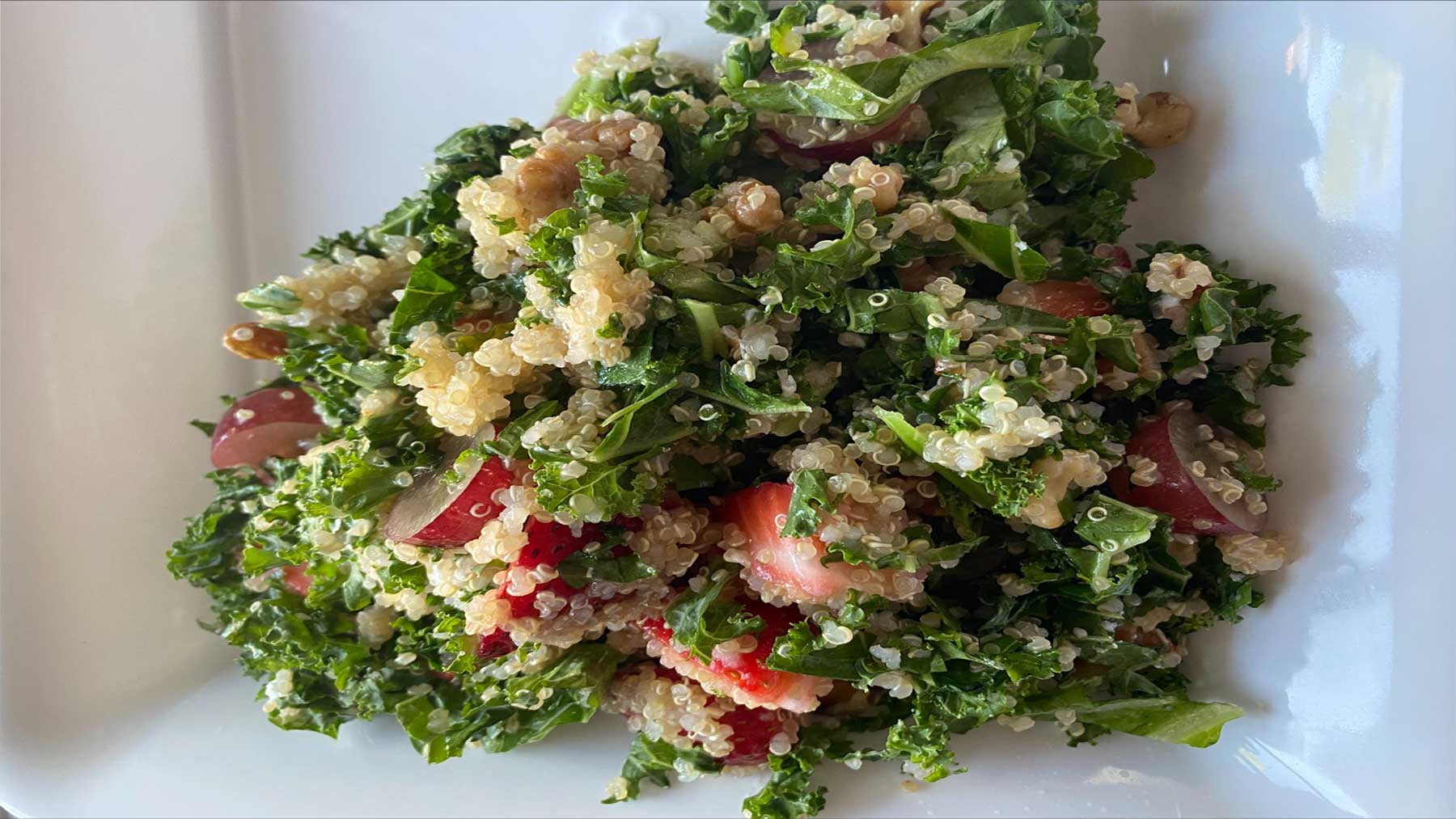 kale and berry salad on a plate