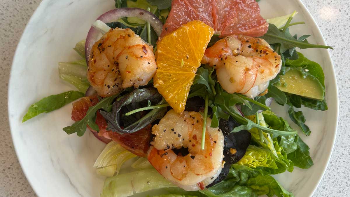 shrimp and citrus salad on a plate