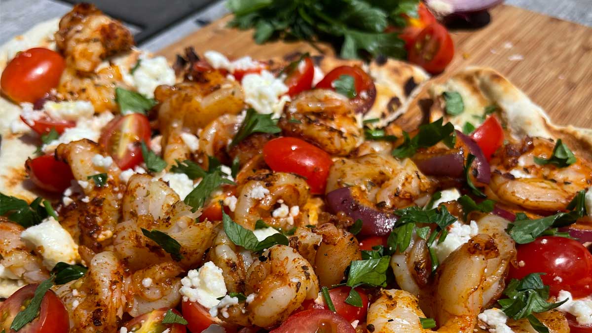 shrimp pizza on a platter