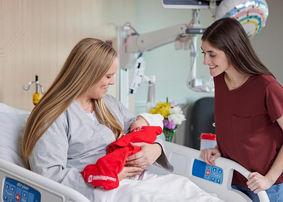mom and newborn baby in hospital room