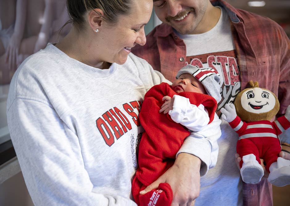 new parents with their newborn baby