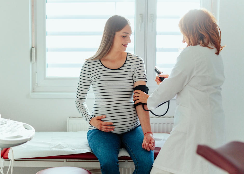 Pregnant woman gets blood pressure checked