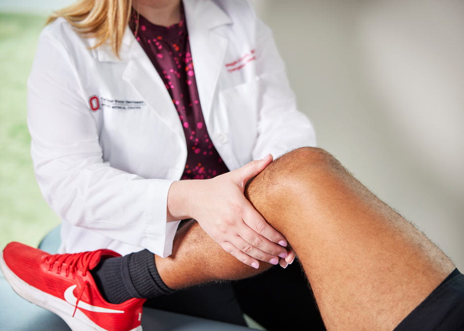 Dr-Kirwin-performing-a-knee-exam
