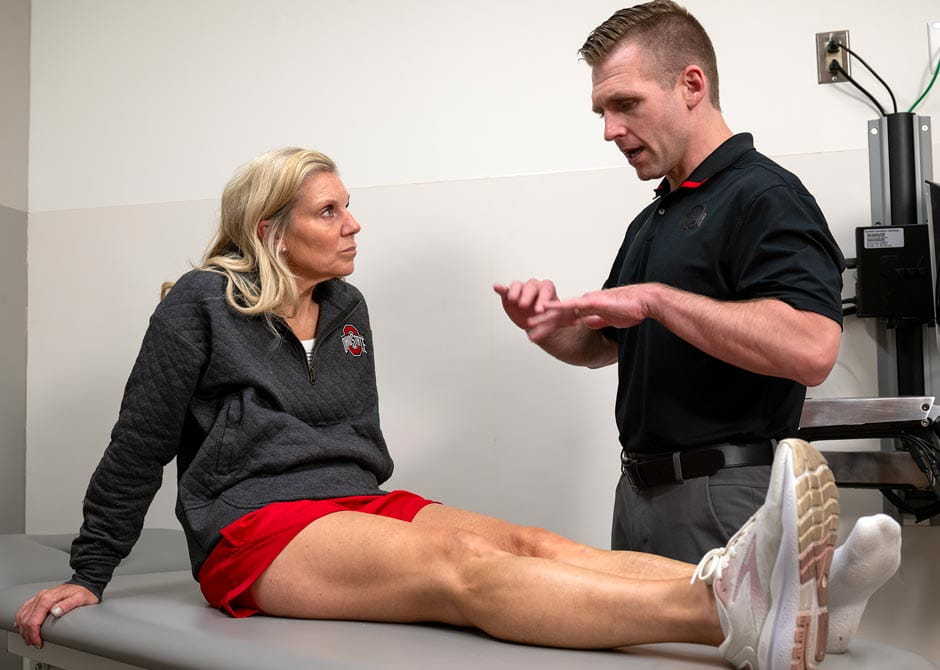 Dr. Baria performing a knee exam