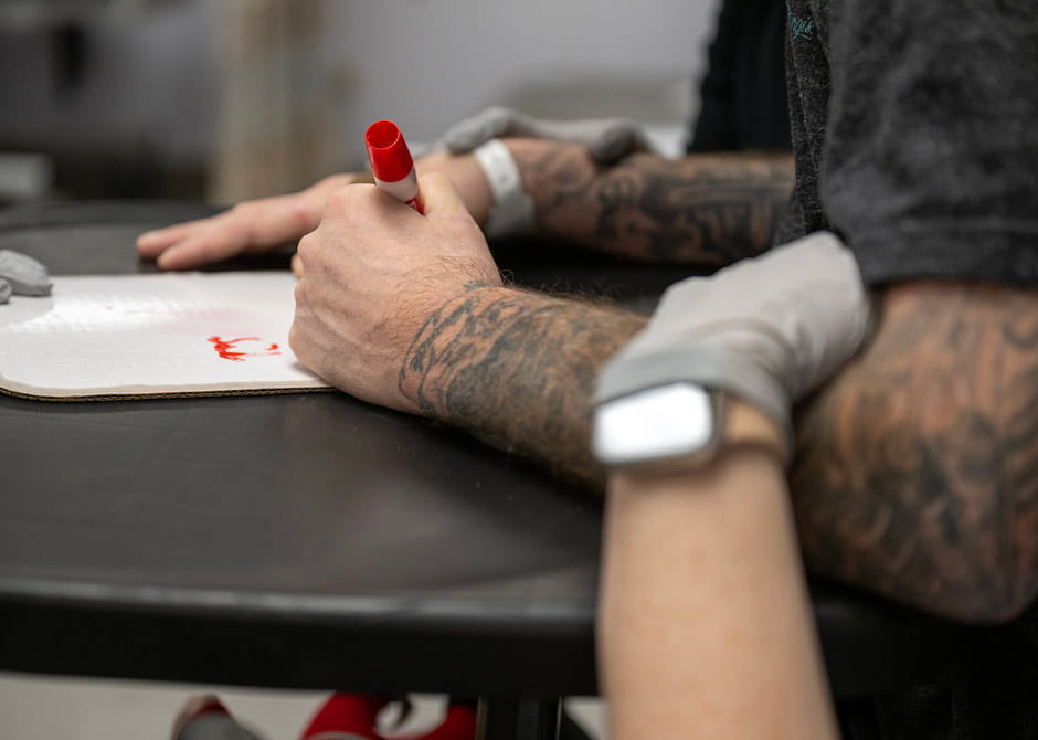 man writing on a whiteboard in therapy