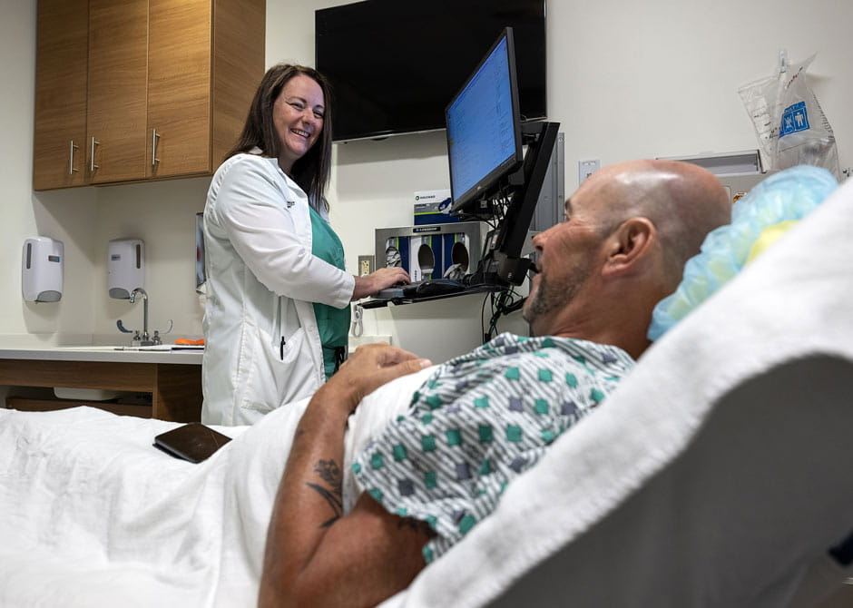 Dr. Whitney Luke with patient in inpatient rehabilitation