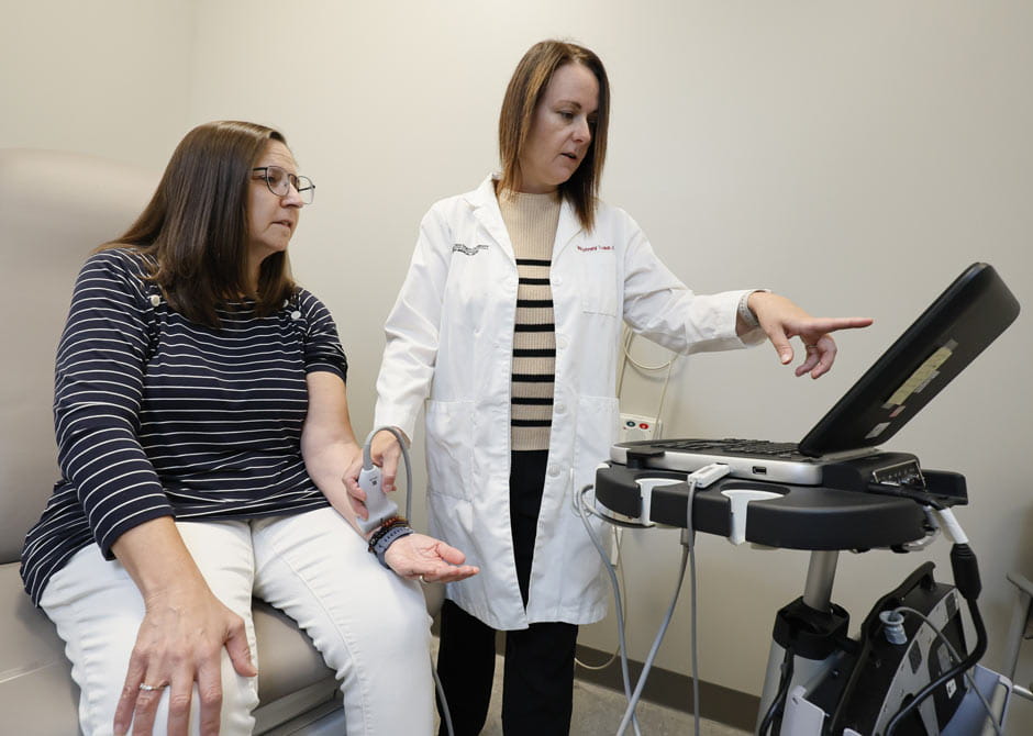 Dr. Whitney Luke with patient in outpatient rehabilitation