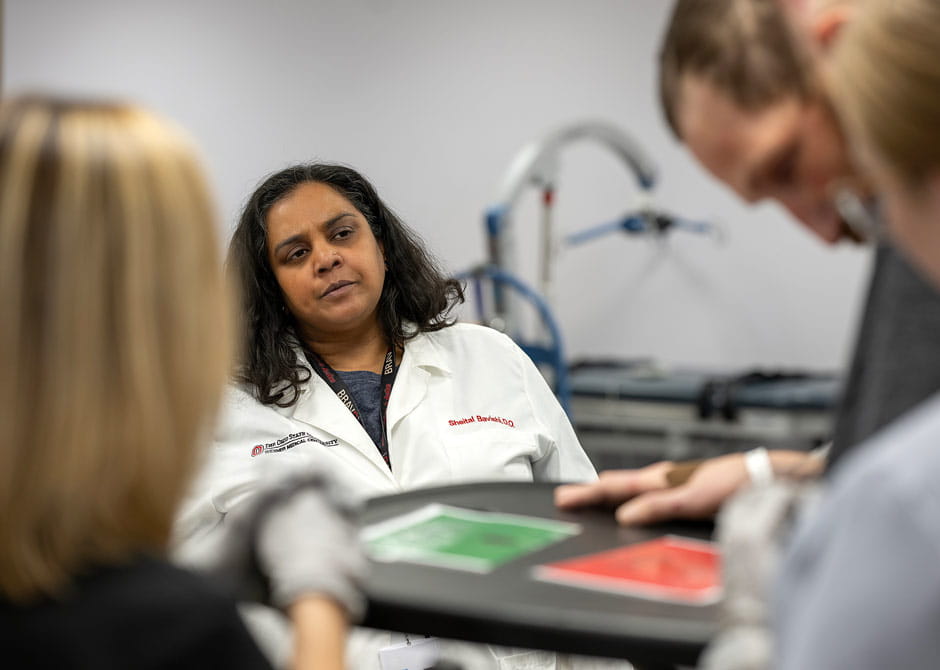 Dr. Bavishi talking to patients