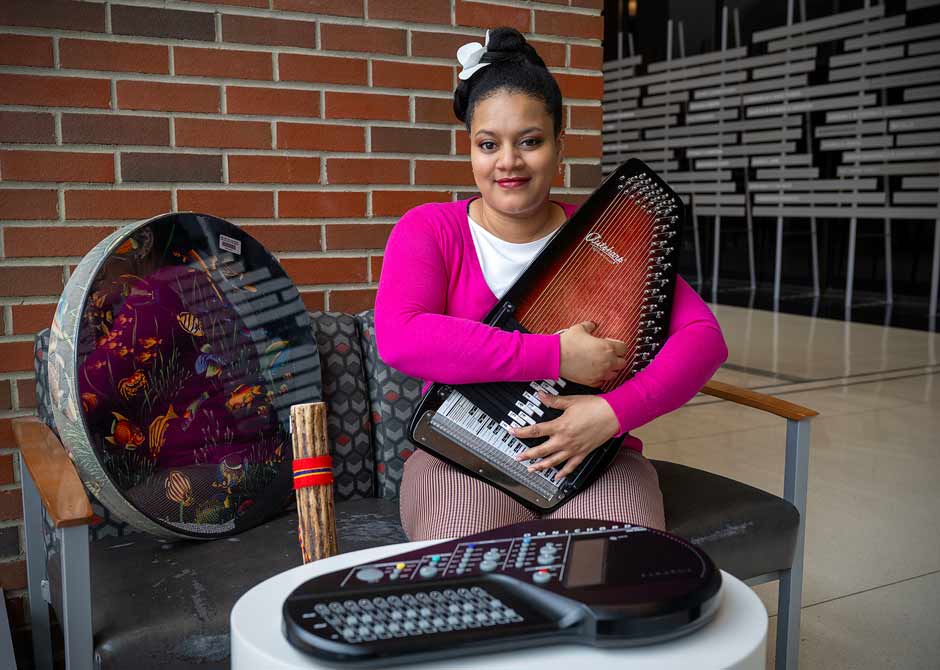 woman posing with multiple instruments