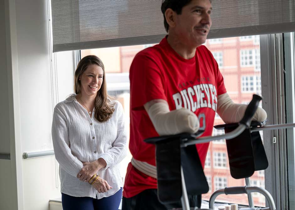 Amputee patient using assistive device to walk