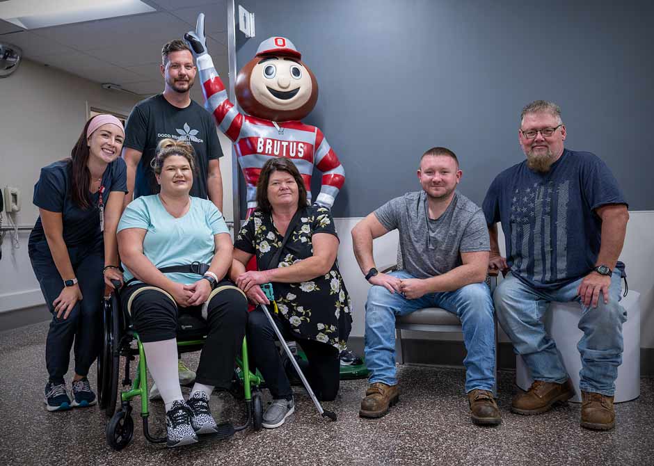 Rehabilitation patients and providers with Brutus mascot