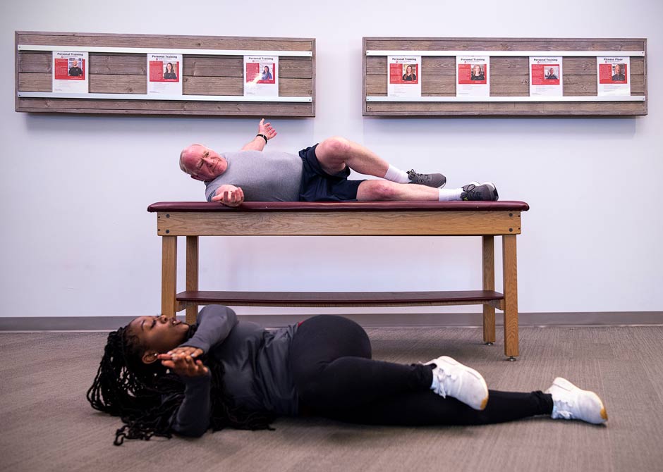 provider instructing patient through physical therapy