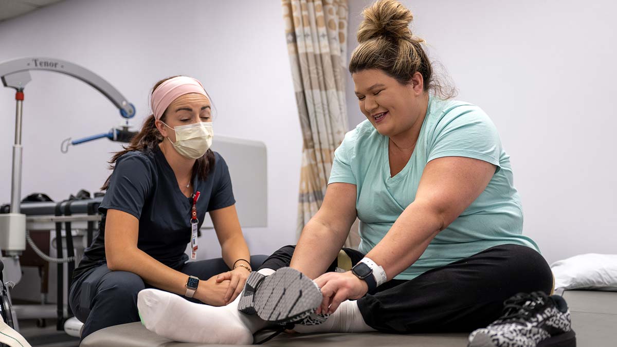 A Dodd Hospital patient works with a physical therapist