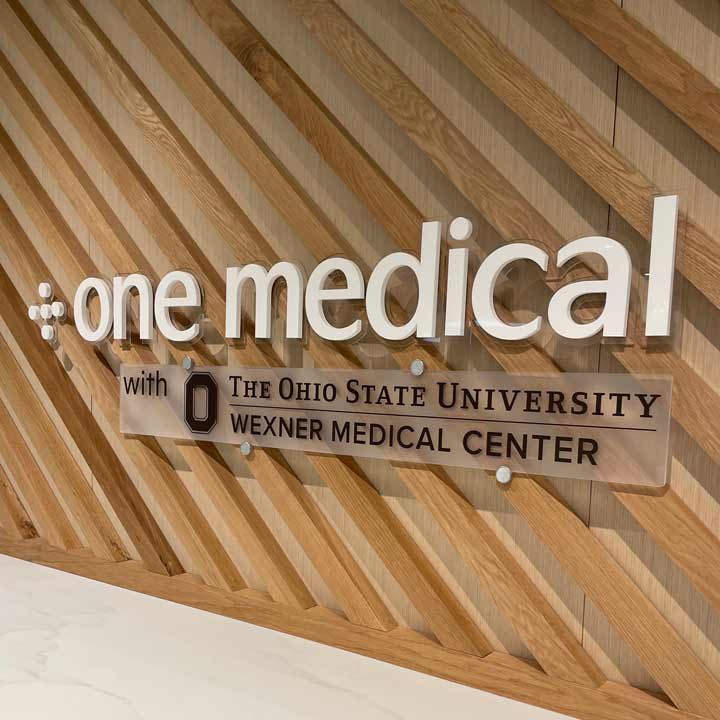One Medical and Ohio State logos on a decorative wall