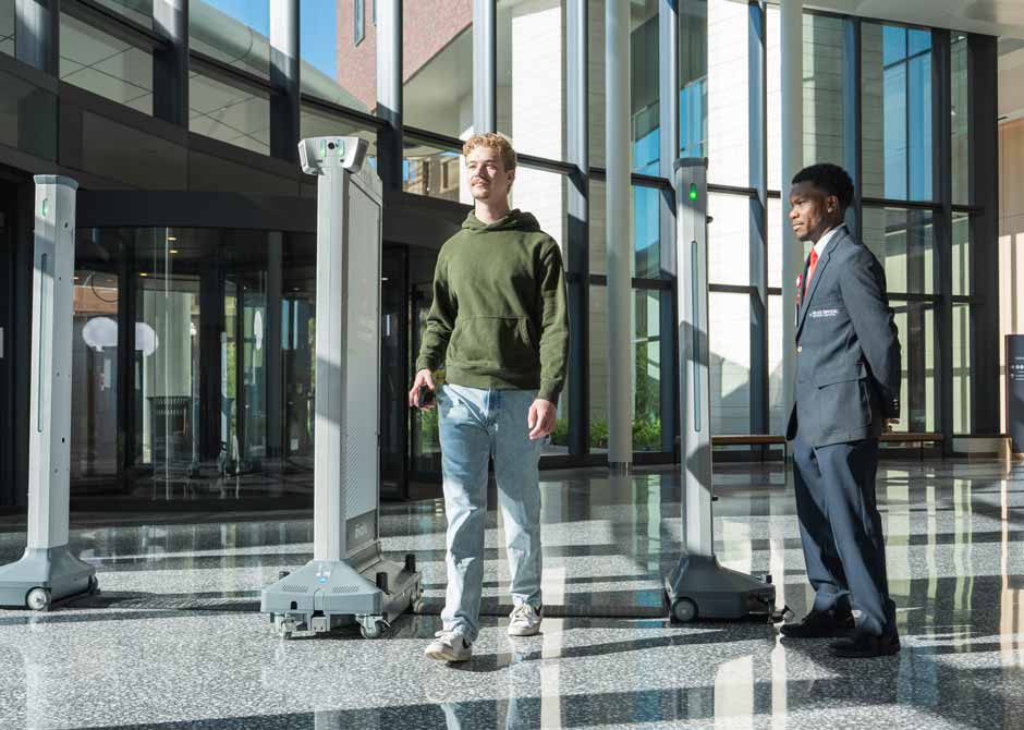 man walking through security scanner at The Ohio State University Wexner Medical Center hospitals