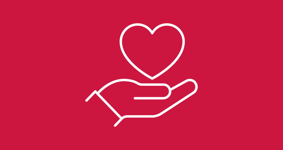 Icon of a hand holding up a heart symbol